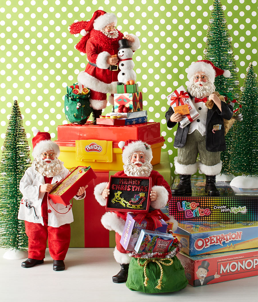 Collection of Santa Claus figurines with toys and games on a polka dot background