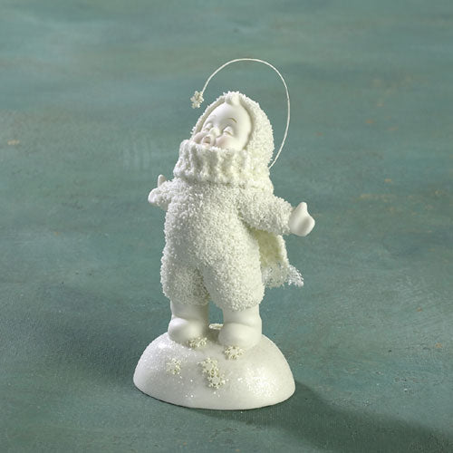 Cute image of Snow Baby feeding a seal with a bottle. Antique not a popular Dept 56 rep